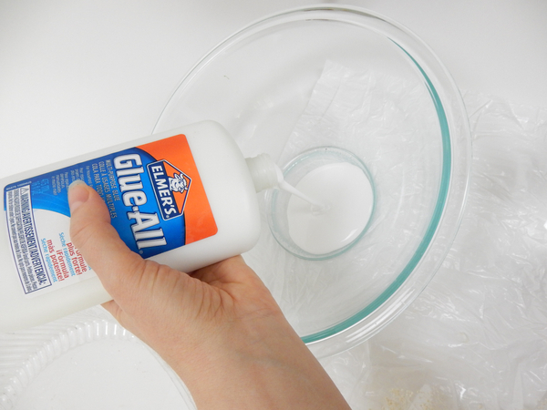 Pour wood glue into a deep container