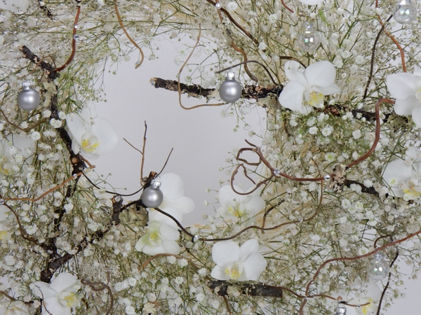 Silver baubles in a winter white wreath Silver baubles in a winter white wreath
