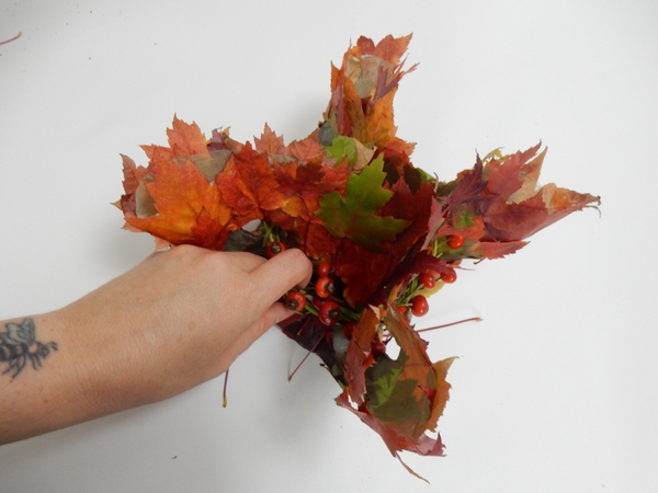 Weave in the shorter rosehip stems to add more hips