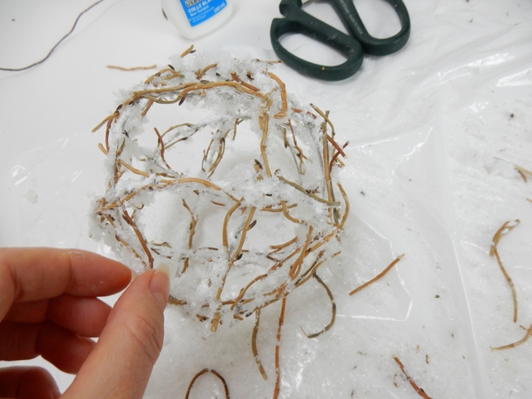 Add another layer of twigs and snow Add another layer of twigs and snow