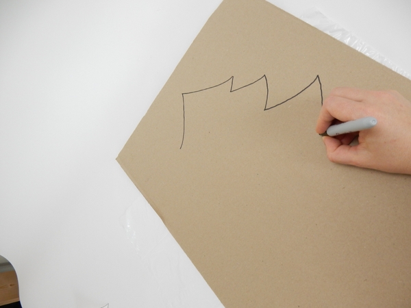 Draw a large Christmas tree shape on cardboard Draw a large Christmas tree shape on cardboard