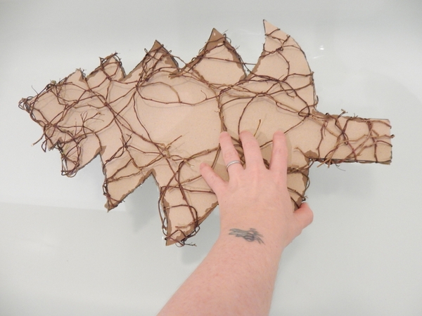 Dunk the cardboard shape in a tub filled with warm water Dunk the cardboard shape in a tub filled with warm water