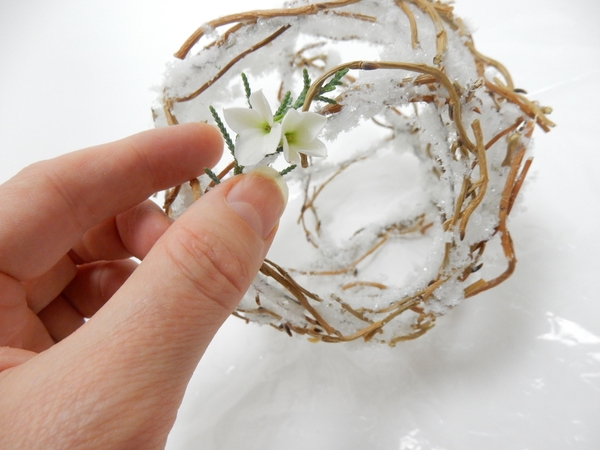 Weave in winter greenery and Kalanchoe flowers