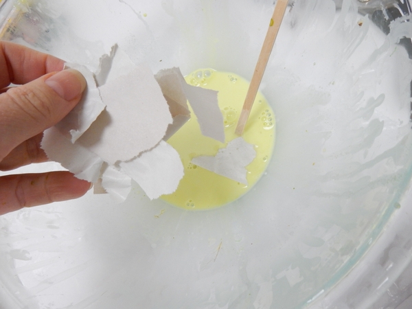 Dip newsprint paper in the glue. Dip newsprint paper in the glue.