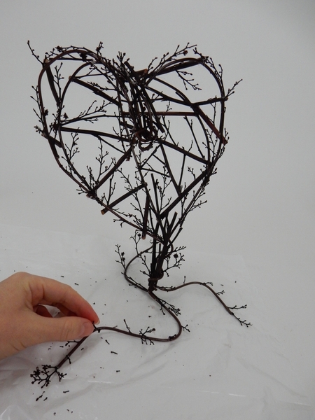 Add a few delicate twigs to the base Add a few delicate twigs to the base