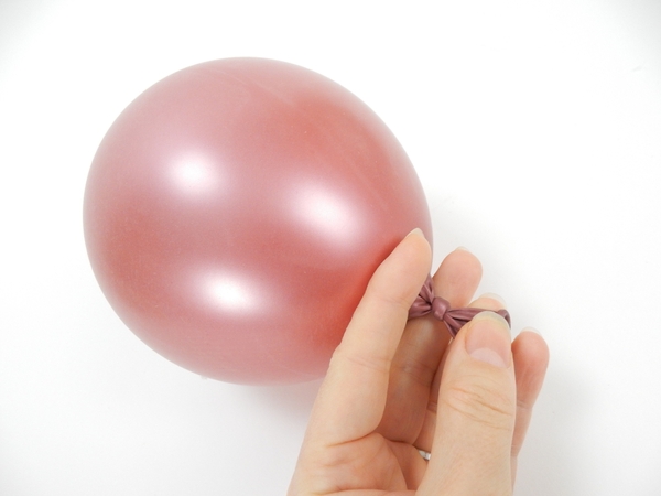 Blow up the balloon and secure with a knot Blow up the balloon and secure with a knot