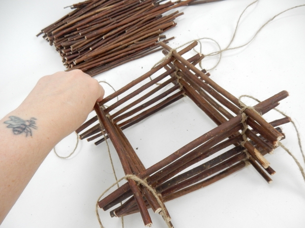 Continue to stack and secure twigs. Continue to stack and secure twigs.