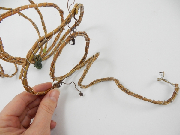 Glue in a few grape vine tendrils Glue in a few grape vine tendrils