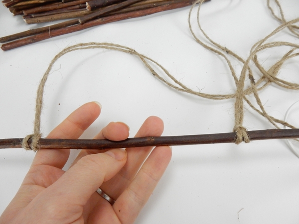 Pull the knot tight and tie the string to the other end. Pull the knot tight and tie the string to the other end.