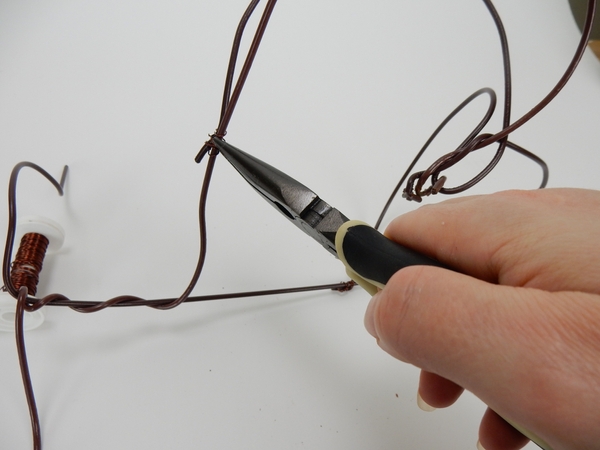 Secure the sides with wire. Secure the sides with wire.