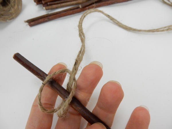 Tie the string to the twig Tie the string to the twig