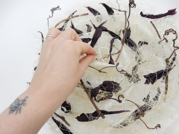 Fill the container with fresh water to just below the paper line and add the floral details Fill the container with fresh water to just below the paper line and add the floral details