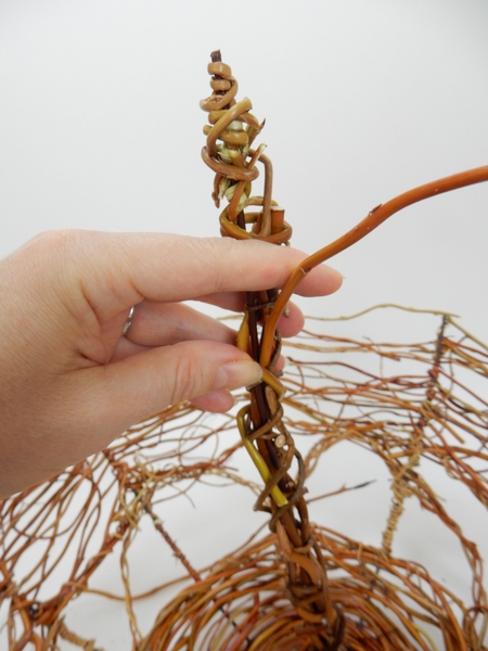 Wrap the handle with willow stems Wrap the handle with willow stems