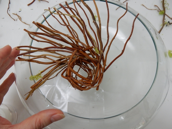 Continue to add twigs to create a spiral. Continue to add twigs to create a spiral.