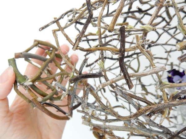 Fit the bottom piece of the twig snippet vase and secure with twigs Fit the bottom piece of the twig snippet vase and secure with twigs