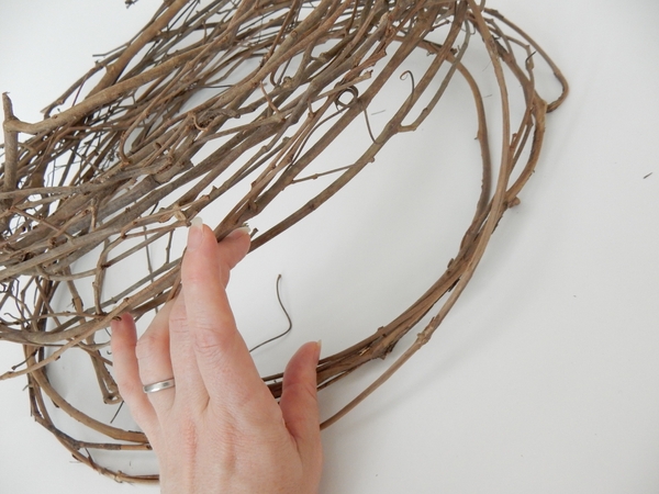 Gently lift the layers of the wreath to separate Gently lift the layers of the wreath to separate