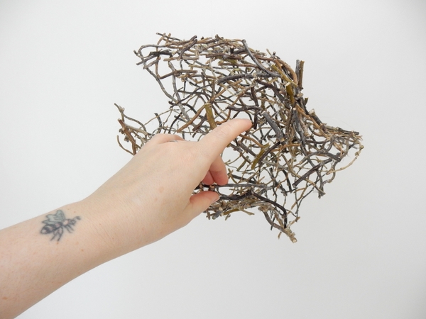 Gently open up the twig shape. Gently open up the twig shape.