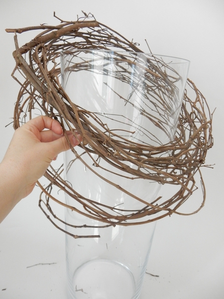 Let the spirals of the vine wreath drop naturally Let the spirals of the vine wreath drop naturally