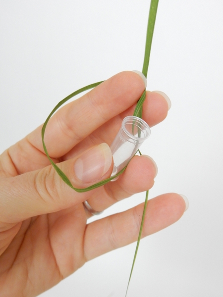 Loosely knot it around the vial Loosely knot it around the vial