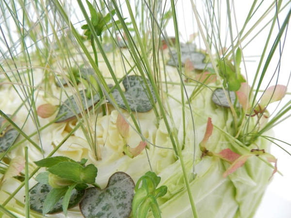 Rosary vine, pansy seedpods, maple seeds and grass in a cabbage