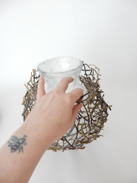 Slip your fingers between the vase and the twigs to release the shape Slip your fingers between the vase and the twigs to release the shape