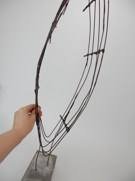 Place the wire armature on the wires attached to the brick. Place the wire armature on the wires attached to the brick.