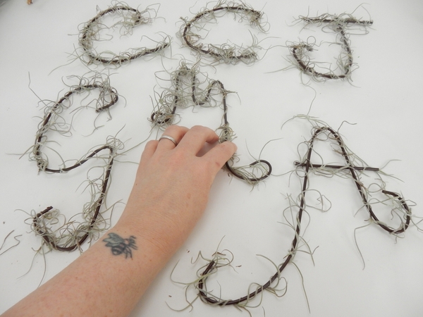 Wrap the letter with a strand of Spanish Moss Wrap the letter with a strand of Spanish Moss