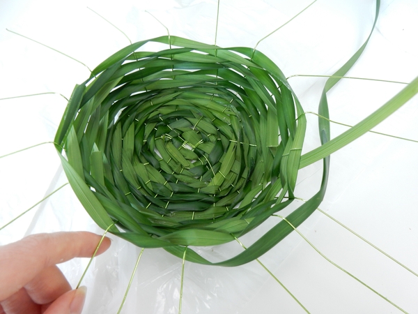 When you have a neat bowl, bend the strands down and straight out to create the brim When you have a neat bowl, bend the strands down and straight out to create the brim