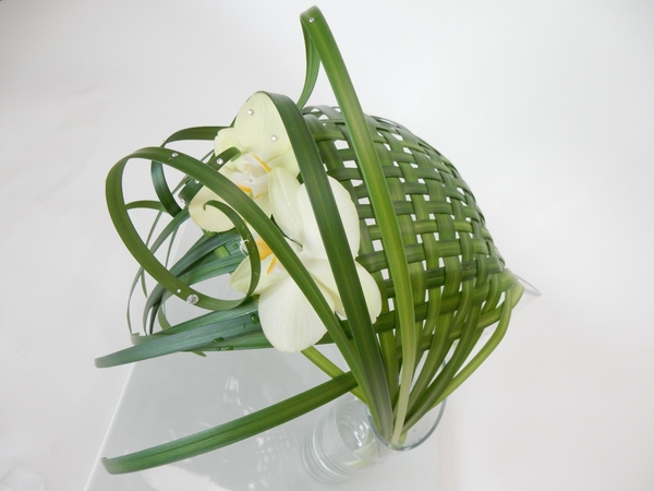 Woven lily grass in two water filled vases Woven lily grass in two water filled vases