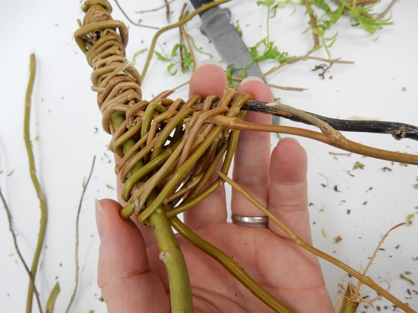 Do the same at the top weaving around the stems down to the wider looped side Do the same at the top weaving around the stems down to the wider looped side