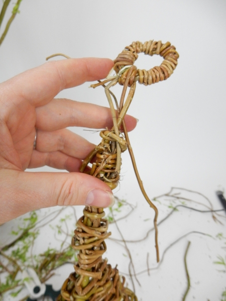 Press the looped stems into the willow nest Press the looped stems into the willow nest