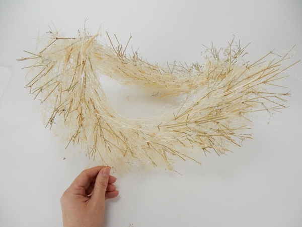 Fold the wreath in half Fold the wreath in half