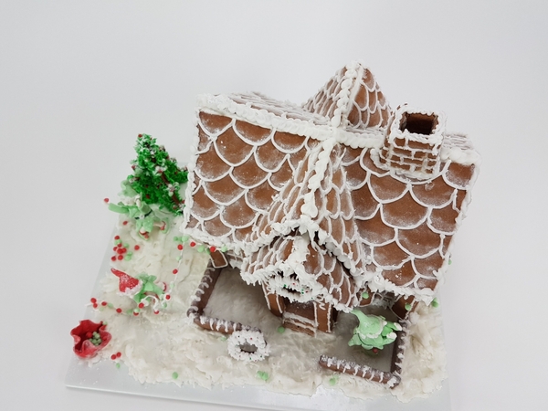 Fresh frosting on the gingerbread house Fresh frosting on the gingerbread house