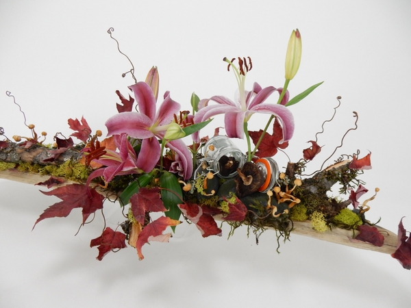 Lilies, moss, autumn leaves and mushroom design Lilies, moss, autumn leaves and mushroom design