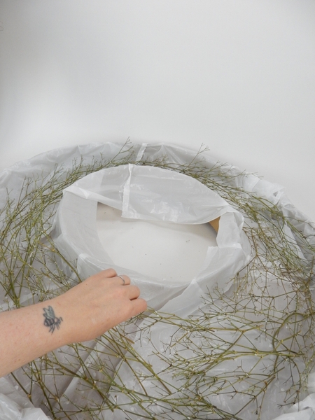 Set the glued wreath shape aside to dry completely Set the glued wreath shape aside to dry completely