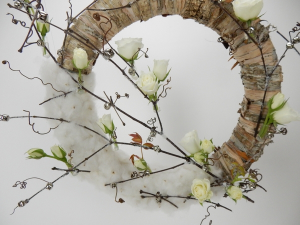Add tiny silver bells to the wreath design Add tiny silver bells to the wreath design