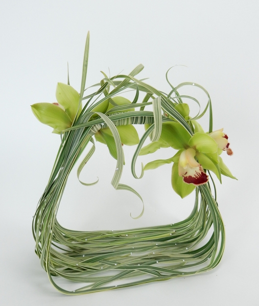 Cymbidium orchids and curled grass with crystals Cymbidium orchids and curled grass with crystals
