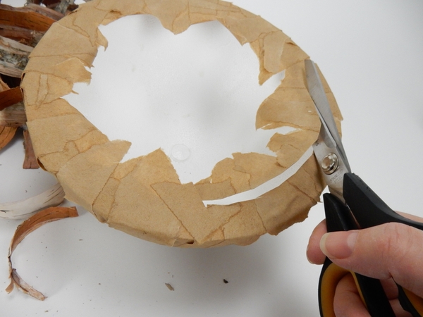 Cut away any extra bits of paper Cut away any extra bits of paper