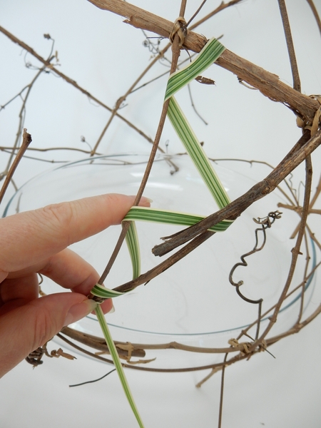 Fold the stem up and around the next twig in a zig zag pattern Fold the stem up and around the next twig in a zig zag pattern