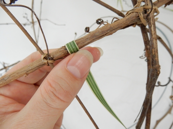 Glue a blade of grass over a grapevine twig