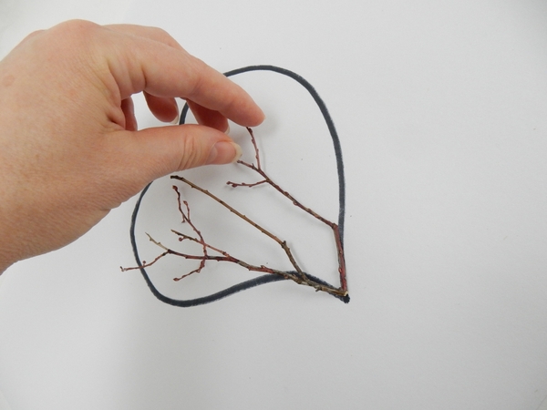 Match a few sprouting spring twigs to follow the shape of the heart Match a few sprouting spring twigs to follow the shape of the heart