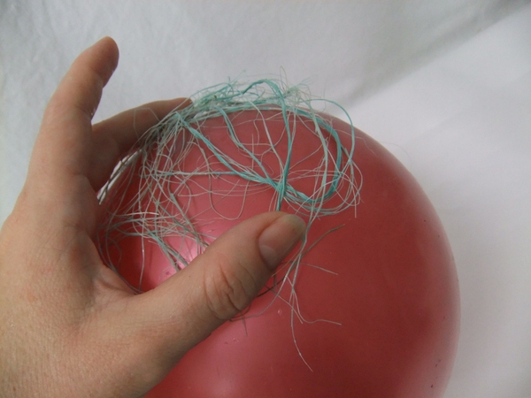 Cover the balloon with the glue soaked sisal Cover the balloon with the glue soaked sisal