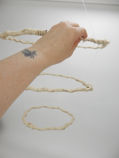 If you want the design to twirl gather and connect all the line at the top in a single knot If you want the design to twirl gather and connect all the line at the top in a single knot