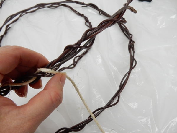 Push the sisal through the wreath Push the sisal through the wreath