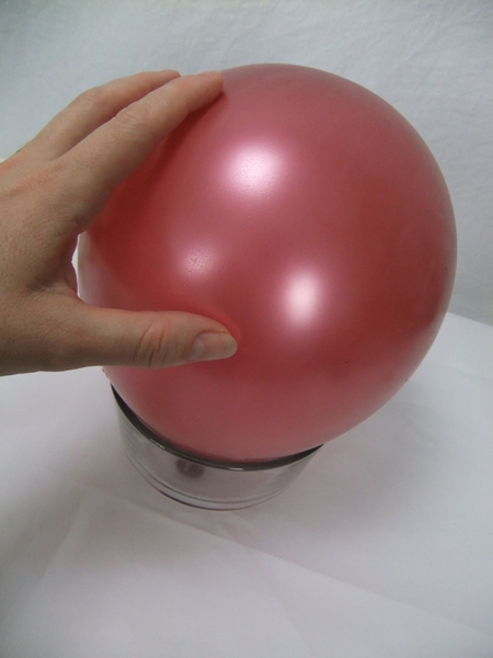 Set the balloon on a small bowl so that it doesn't roll around while you work Set the balloon on a small bowl so that it doesn't roll around while you work