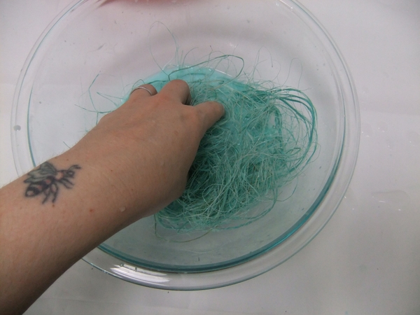 Soak the sisal in the glue mixture Soak the sisal in the glue mixture