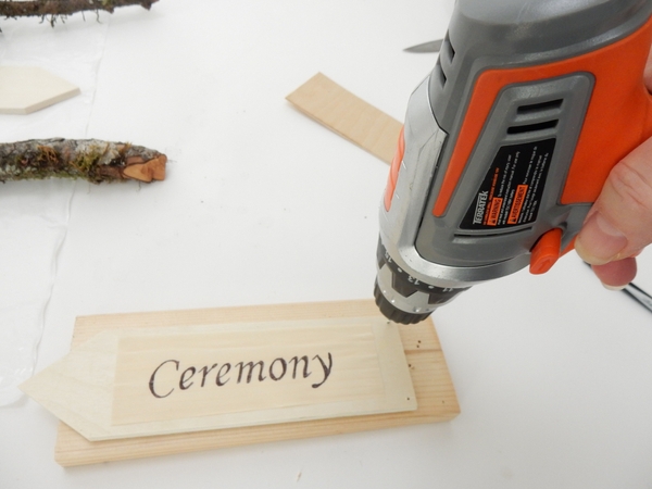 Write your directions on the arrow shaped wood pieces and drill holes into it so that you can hang it like a mobile Write your directions on the arrow shaped wood pieces and drill holes into it so that you can hang it like a mobile