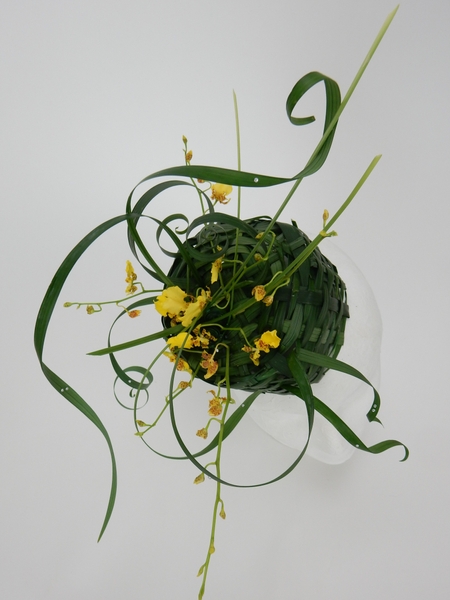 Easter bonnet woven from lily grass with oncidium orchids Easter bonnet woven from lily grass with oncidium orchids