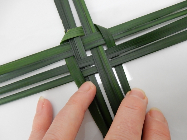Fold the blade of grass down and weave Fold the blade of grass down and weave