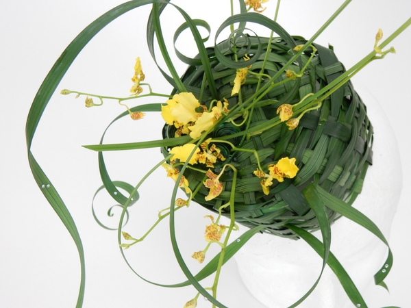 Pillbox hat woven from lily grass and oncidium orchids Pillbox hat woven from lily grass and oncidium orchids